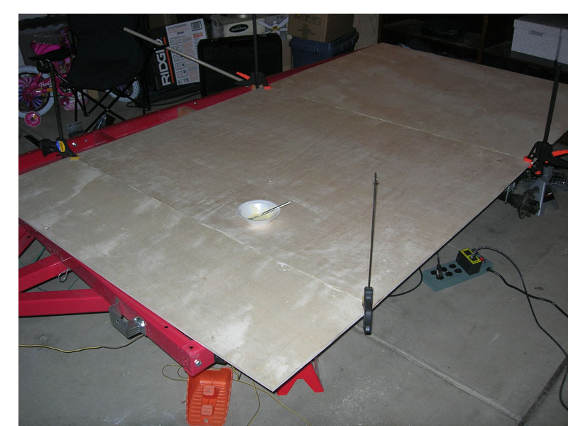 Two floor sheets clamped while the biscuit joints glue up
