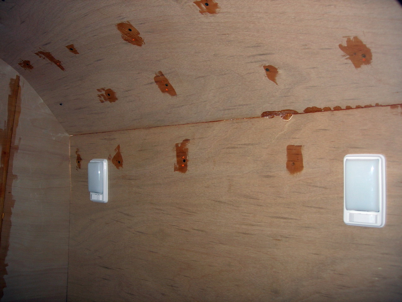 Screws through the interior roof into the spars
