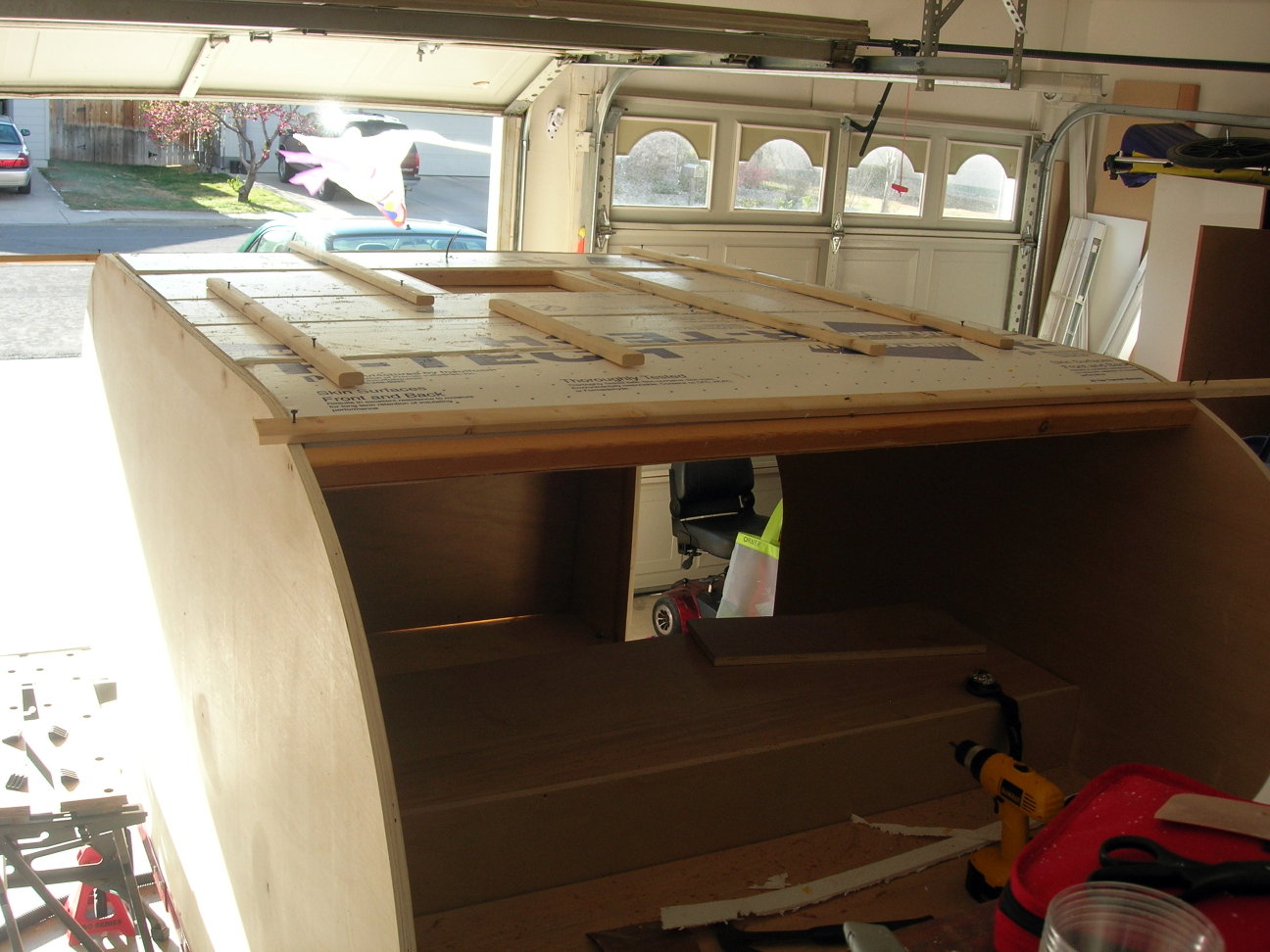 Slats glued to the interior roof and held by temporary spars