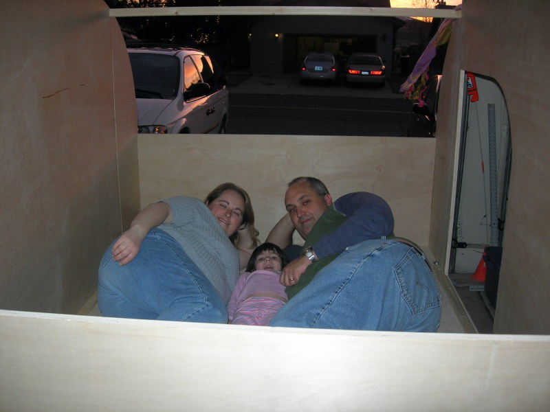 The family lying inside the open trailer