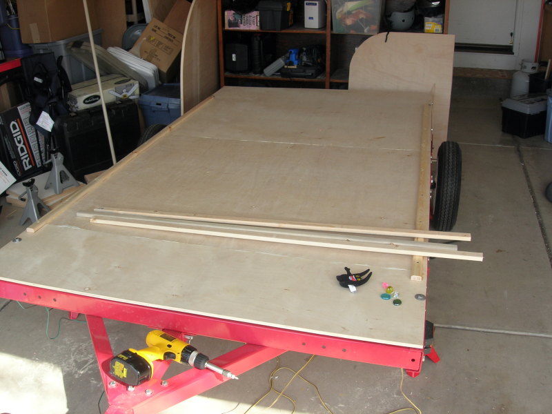 1x2 cleats screwed to the floor for the walls to fasten to