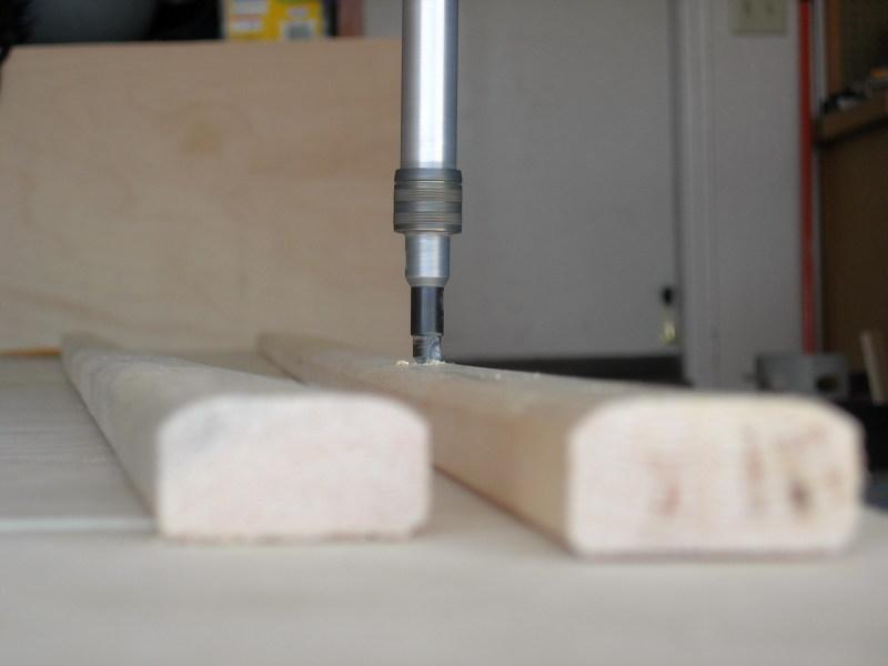 Screwing down a floor cleat, photographed by Justin