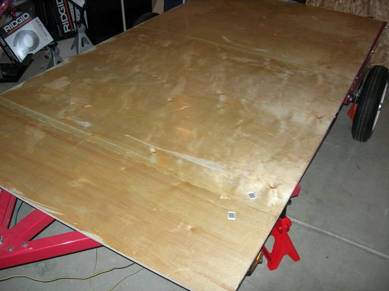 The underside of the floor, wet with a first coat of epoxy